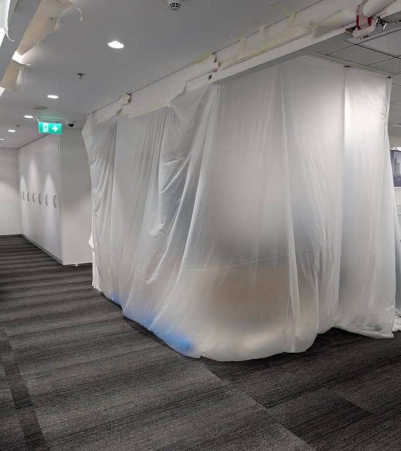 Protected commercial interior prepared for renovation work